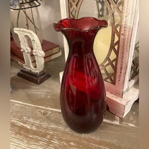 Vintage Anchor Hocking Royal Ruby Red glass vase with a ruffled rim.